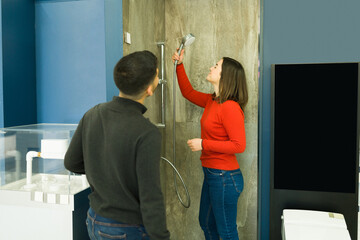 Husband and wife remodeling the bathroom