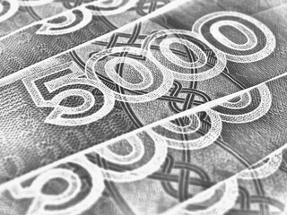 Russian banknotes 5000 rubles close-up. Fragment of a bill with focus on denomination figure. Black...