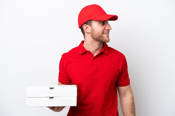 Pizza delivery caucasian man with work uniform picking up pizza boxes isolated on white background...