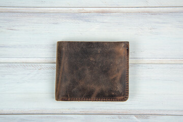 men fashion leather wallet on the white wooden table