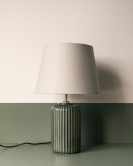 green lamp with white shade