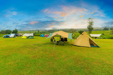 camping,golden sunrise illuminated camping tent dramatic mountain landscape panorama thailand