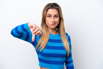 Young caucasian woman isolated on white background showing thumb down with negative expression