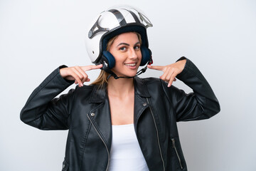 Young caucasian woman with a motorcycle helmet isolated on white background giving a thumbs up gesture