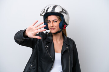 Young caucasian woman with a motorcycle helmet isolated on white background counting five with fingers