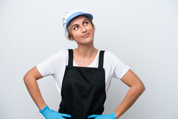 Fishwife woman isolated on white background posing with arms at hip and smiling