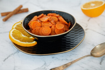Carrot Tzimmes stew with sweet orange juice in a bowl. Typical Jewish dish food.