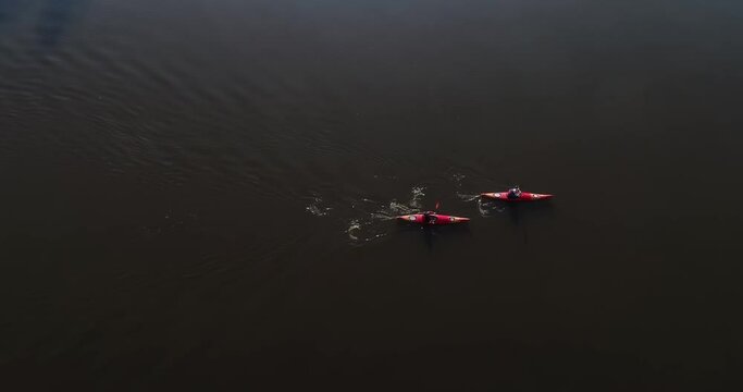 Ukraine. Kyiv. A couple on a canoe float on the river. Autumn. Desna river
