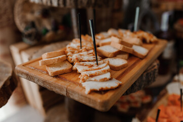 Slicing different types of meat. Meat snacks on the table. wedding buffet. Catering