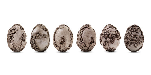 A row of vintage monochrome Easter eggs with a small shadow isolated on a white background. Sepia coloured unusual easter eggs. Easter background or banner not only for web graphic.