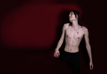 Naklejka premium A young guy is engaged in sports exercises