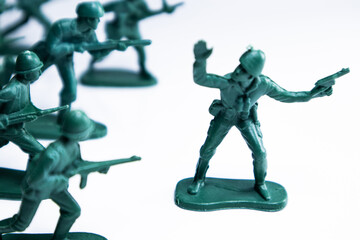 Green toy soldiers on white background. Ukraine Russia war concept. Military war.