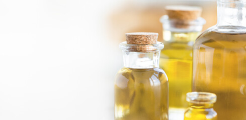 Assortment of organic essential oils. Natural moisturizing body and face treatment. Plant extract for healthy young skin. Relaxation, aromatherapy, salon spa. Close up, copy space