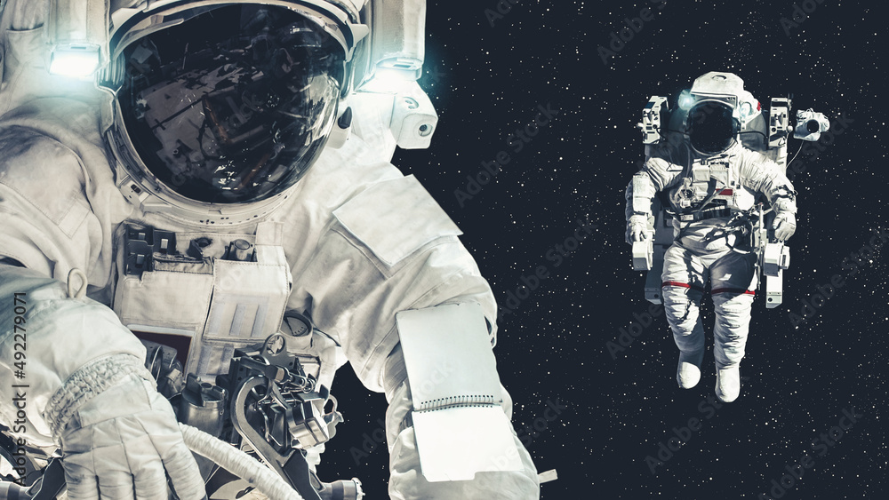 Wall mural astronaut spaceman do spacewalk while working for spaceflight mission at space station . astronaut w