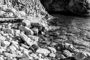 Close-up background of stone beach with rocks. Grey stone beach for poster, calendar, post,...