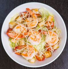 Healthy salad plate. Fresh seafood recipe. Grilled shrimps and fresh vegetable salad and egg. Grilled prawns. Healthy food. Flat lay. Top view