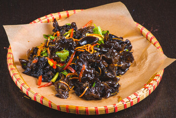 shiitake black mushroom salad on grey table