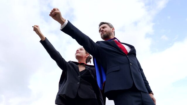 businesspeople in superhero suit good business partners on sky background, partnership