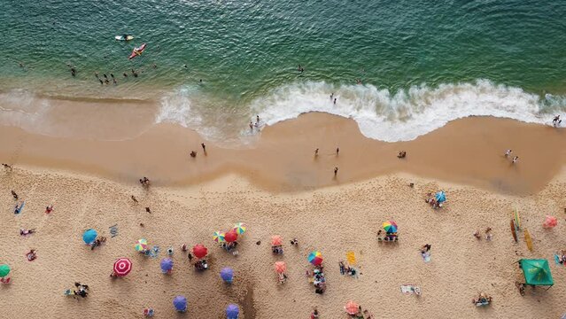 Aerial view of Praia Vermelha, in the neighborhood of Urca in Rio de Janeiro, Brazil. The hills of P&atilde;o de A&ccedil;ucar and Urca. Sunny day with some clouds at dawn. Drone take.