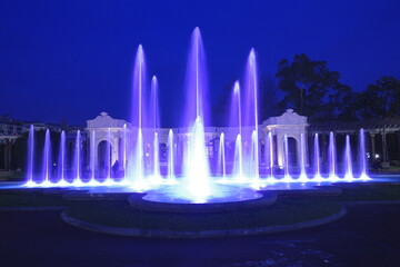 Colorful artistic fountain at night