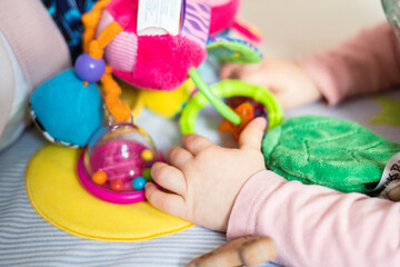 Baby, toodler playing with toys, close up picture, hands only