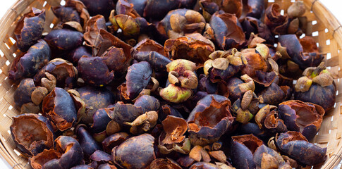 Dried mangosteen peel in bamboo basket