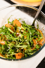 Raw salad with rocket, carrot, pepper, bowl, healthy diet, suitable for vegans and vegetarians