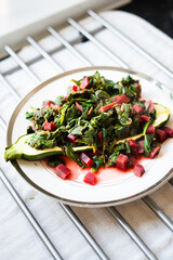 Roasted courgette with spinach and betroot served on a plate