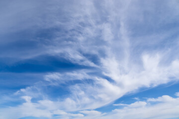 Stunning cirrus cloud formation panorama in a deep blue sky