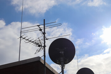 A satellite dish against blue sky