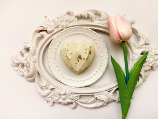 Cookie heart-shaped and tulip on white retro frame