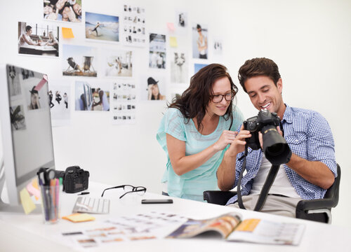 There are some really great images here. A photographer looking at his images in his office with his assistant.