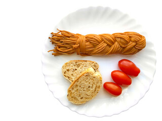 Cheese braid, two slices of bread and cherry tomatoes, isolated on white