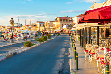 The main street running through the picturesque village of Aegina, on the island of Aegina Greece,...