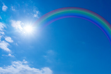 Bright blue sky with rainbow and sunshine_blue_49