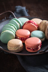 Tasty and colorful macaroons with berr  fruits flavor.