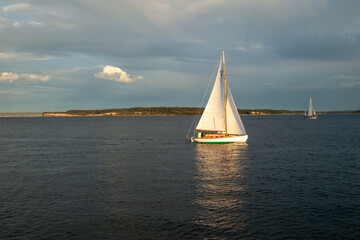 Fototapeta premium A sailboat at sunset in Washington state