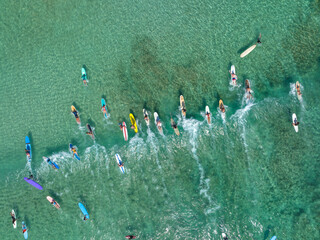 Surfboards floating in Waikiki beach water