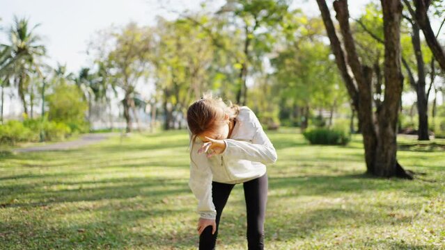 Confidence Asian woman in sportswear jogging exercise at city public park in summer morning. Healthy wellness female athlete enjoy outdoor lifestyle activity sport training fitness running workout