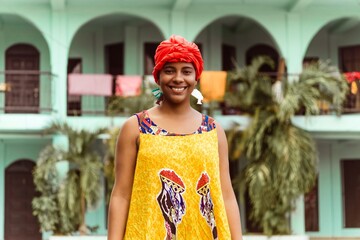 Portrait of black caribbean woman with traditional clothing.
