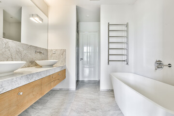 Double sink in modern stylish bathroom with walk-in shower