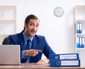 Young male accountant working in the office