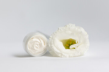 Cream in a jar on a white background