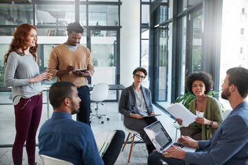 Moulding their ideas around success. Cropped shot of a group of young creatives having a meeting in...