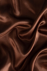 Smooth elegant brown silk or satin texture can use as abstract background.
