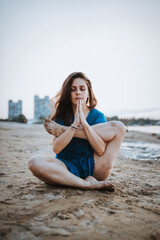 Fototapeta na wymiar Woman meditating yoga lotus pose at morning, Lifestyle relaxation emotional concept summer vacations outdoor harmony with nature calm scene