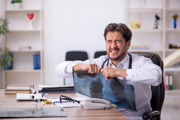 Young male doctor radiologist working in the clinic