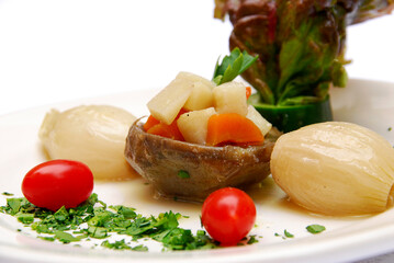 sweet potato dish with vegetables and grilled onions on white background