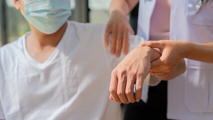 Physical therapy concept for a young man with hand pain and complete symptom check