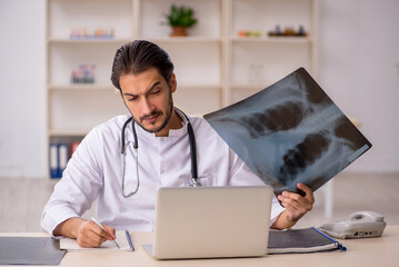 Young male doctor radiologist working in the clinic